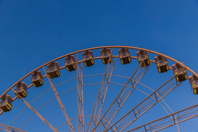 Part of a ferris wheel in sunset