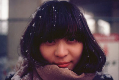 Close-up portrait of smiling woman during winter