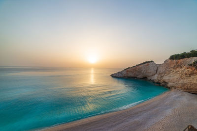 Scenic view of sea against clear sky during sunset