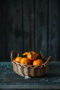 Close-up of fruits in basket on table