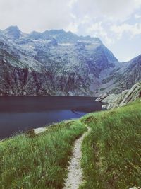 Scenic view of lake and mountains against sky