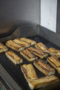 High angle view of meat on barbecue grill