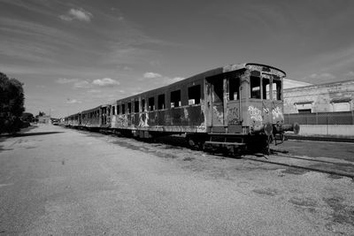 Train on railroad track against sky