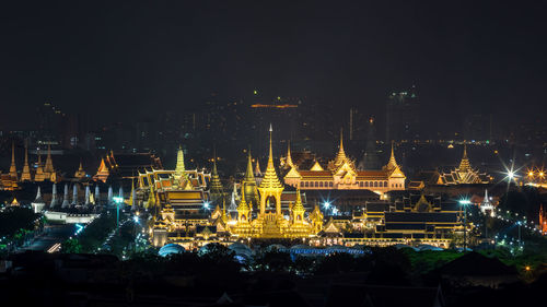 Illuminated buildings in city at night