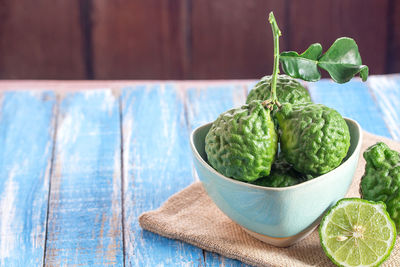 Close-up of fruits in bowl on table