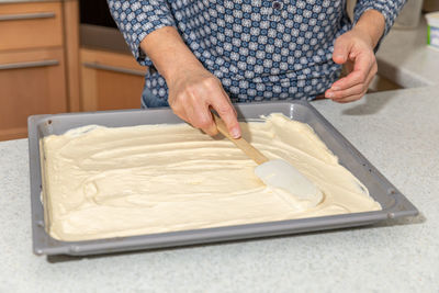 Midsection of man preparing food at home