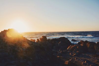 Scenic view of sea at sunset