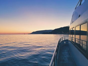 Scenic view of sea against clear sky during sunset