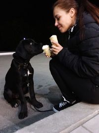 Full length of woman holding dog