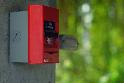 Close-up of red fire alarm box