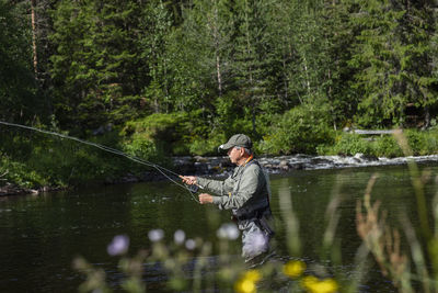 Man fishing in river