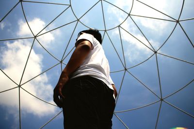 Low angle view of person standing against sky