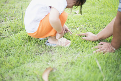 High angle view of boy playing on grassy field