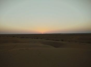 Scenic view of landscape at sunset