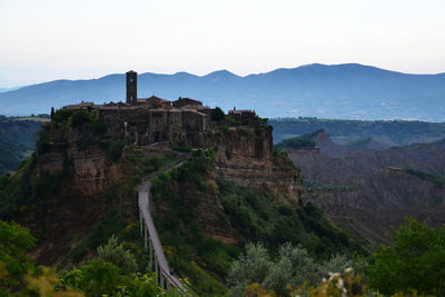 Castle on mountain against sky