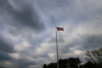 Low angle view of flag against sky