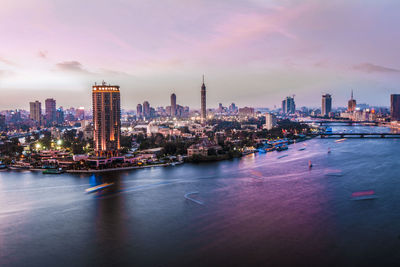 Illuminated city at waterfront