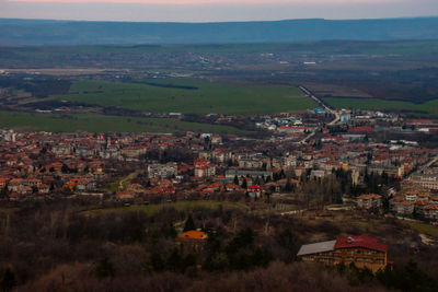 Aerial view of cityscape against sky