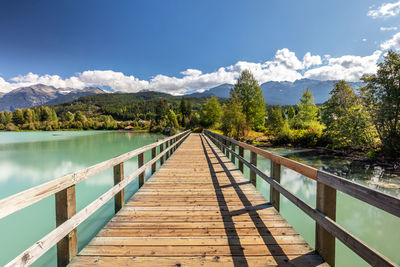 Pier over lake against sky