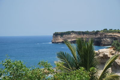 Scenic view of sea against clear blue sky