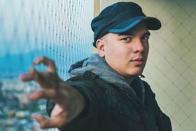 Portrait of man standing outdoors