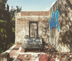 Abandoned building against blue sky