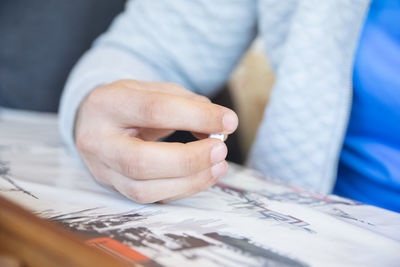 Midsection of man playing leisure game 