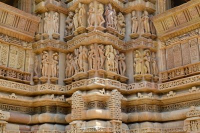Low angle view of carvings on a temple wall at khajuraho 