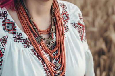 Midsection of woman standing at home