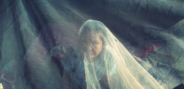 Full frame shot of woman covering face