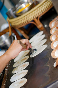 High angle view of person making food on table