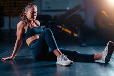 Young woman exercising in gym