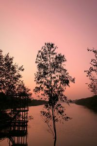 Scenic view of lake at sunset