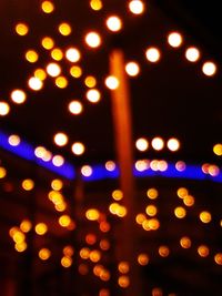 Defocused image of illuminated lights at night