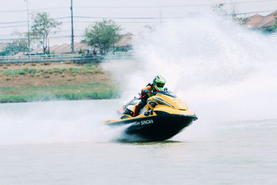 People riding in boat on water