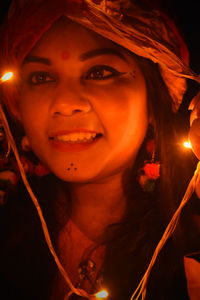 Close-up portrait of smiling young woman