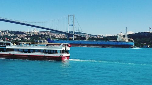 View of bridge over river against clear sky