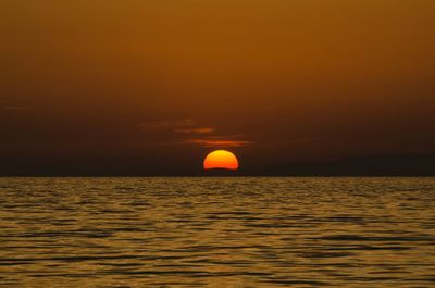 Scenic view of sea at sunset