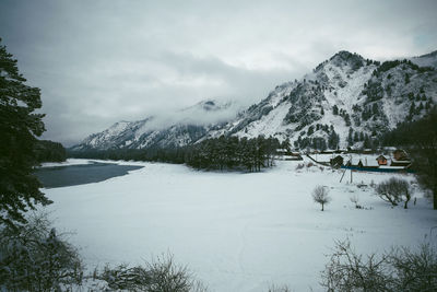 Scenic view of snowcapped mountains against sky