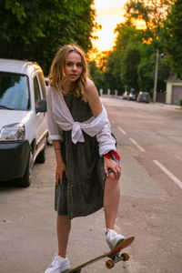 Portrait of young woman in car