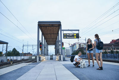 Friends on train station