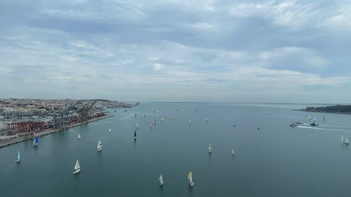High angle view of crowd by sea against sky