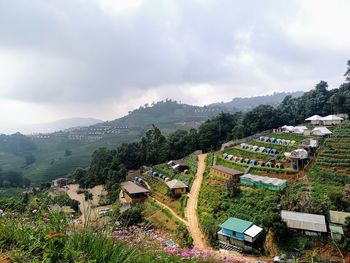 High angle view of trees and buildings against sky