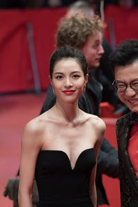 Portrait of young couple standing outdoors