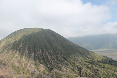 Scenic view of volcanic mountain against sky