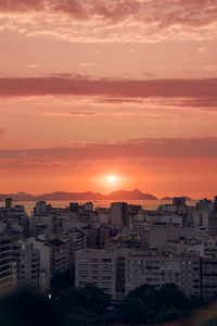 Cityscape against sky during sunset