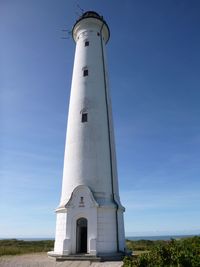 Low angle view of lighthouse against blue sky