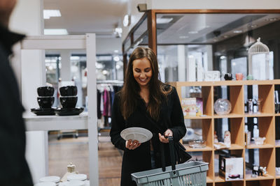 Smiling woman doing shopping