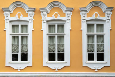 Retro style windows on the facade of the building
