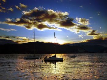 Silhouette of boats in sea